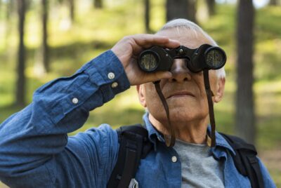 old man exploring nature and bird
